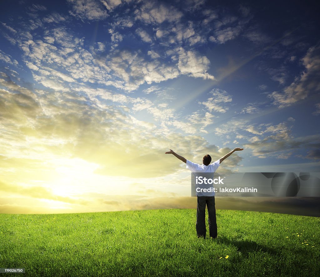 field of grass and happy young man  Adult Stock Photo