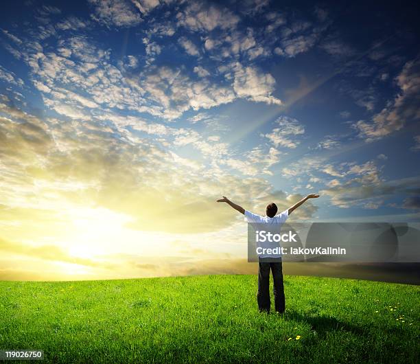 Field Of Grass And Happy Young Man Stock Photo - Download Image Now - Adult, Adults Only, Agricultural Field