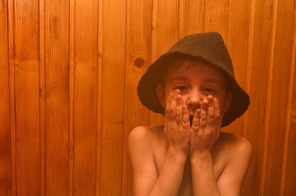 Little boy is relaxing in the sauna. Portrait.