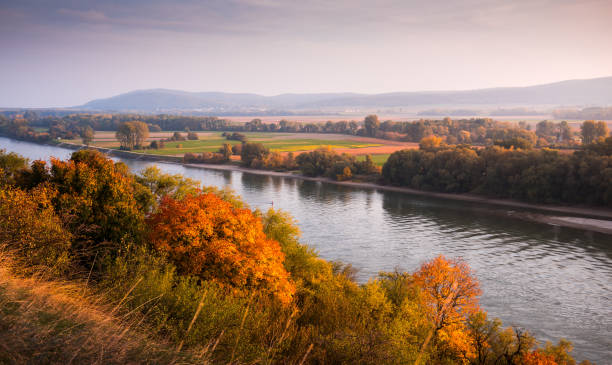 istock Autumn Landscape with River 1190273091