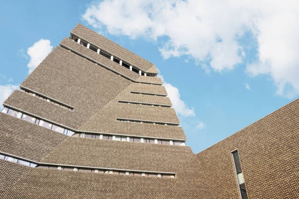 Exterior of Tate modern museum architecture with blue sky in London London, UK - November 05, 2019: Exterior of Tate modern museum architecture with blue sky in London bankside photos stock pictures, royalty-free photos & images