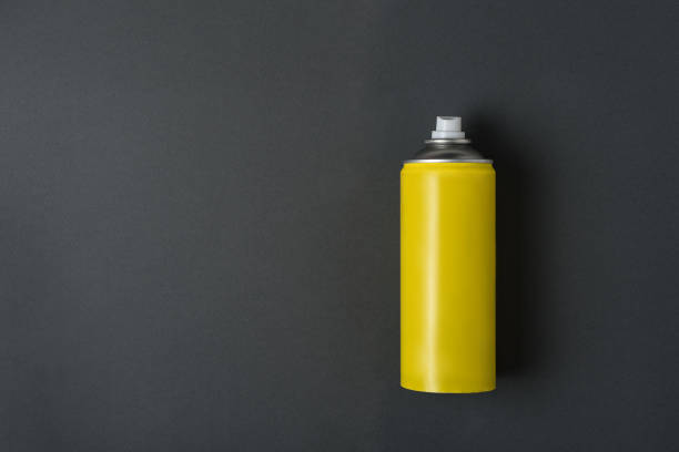 istock Yellow spray can for spray on a black background. No inscriptions. 1190274712