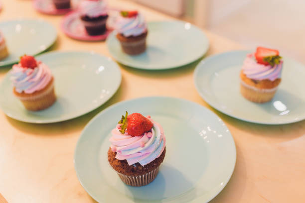 Delicious cupcake with berries on table close up