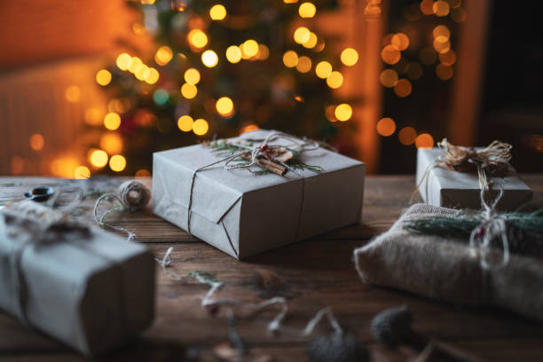 istock Christmas Presents On Wooden Table. 1190277137