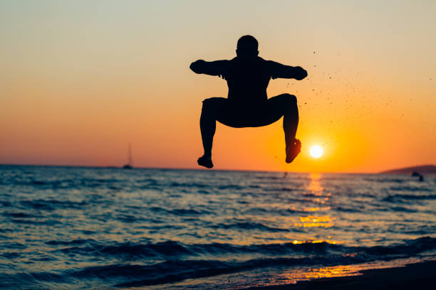istock A silhouette of a young man at a beach 1190277228