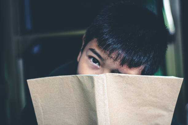 istock The boy was reading a book in a quiet room, Concept read a book. 1190278854