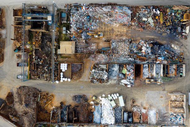 Metal recycling yard from above Directly above view of scrap metal yard. recycling center stock pictures, royalty-free photos & images