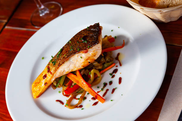 istock Grilled salmon steak with sauteed vegetables 1190284392