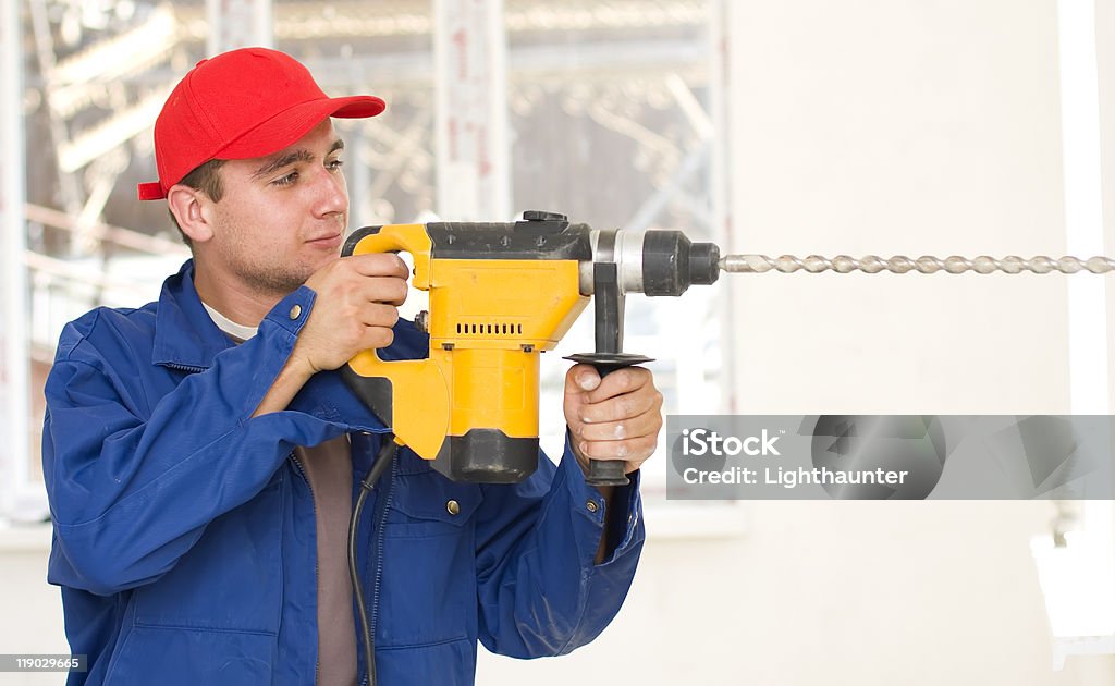 Mann für die Arbeit mit einem großen drill - Lizenzfrei Arbeiten Stock-Foto