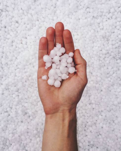istock Hand Holding Hailstones 1190298464