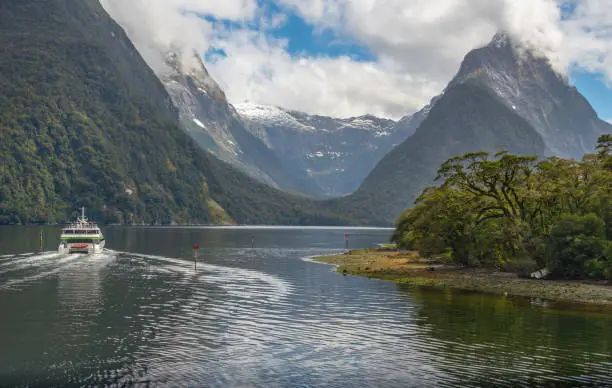 Photo of Tourist cruise sailing in Milford Sound, New Zealand's most spectacular natural attraction in south island of New Zealand.