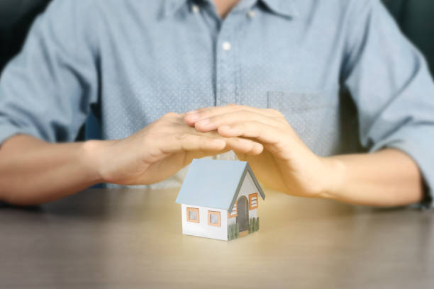 istock Concept by house from in hand 1190302121