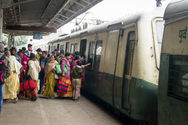 People travelling on local train of Indian Railway Kolkata, India -December 17, 2018 : Lot of passengers trying to board a local train in suburb of Kolkata India. Every day about 3 to 4 millions passengers pass through the station. kolkata to digha train stock pictures, royalty-free photos & images