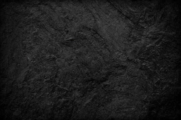 istock Dark grey black slate background or texture. black stone 1190308514