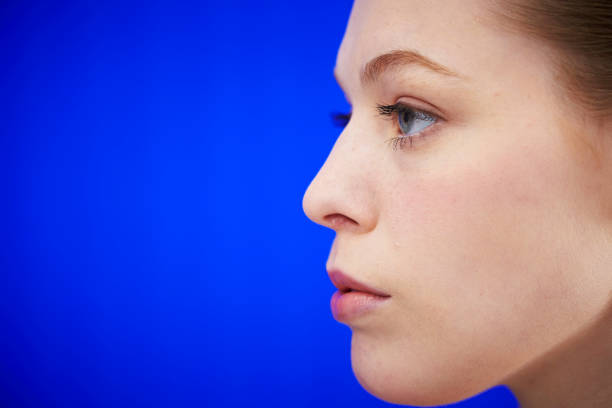 Close-up profile of a caucasian man's face with a sliver of copy space