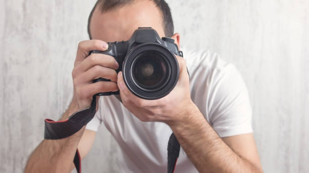 istock Photographer with a Camera. Lifestyle, Work 1190320098