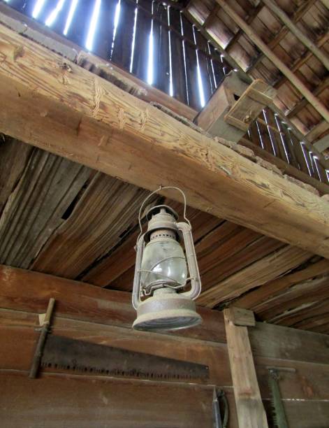 istock Dusty lantern hanging in old stable 1190320880