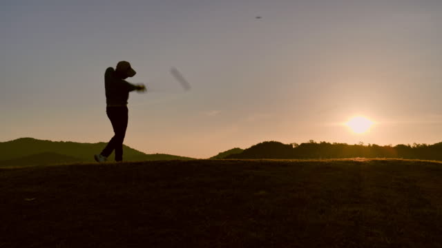 Golfers hit sweeping in the summer for relax time, sport concept.