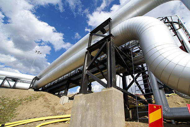 istock industrial pipelines against blue sky 119032317