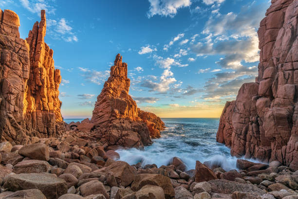 The Pinnacles Rock at Phillip Island, Australia Long exposure at the base of the Pinnacles at sunset as waves crash upon the rocks rock formation stock pictures, royalty-free photos & images