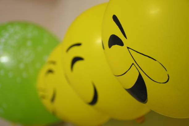 istock Different types of emoji faces on balloons 1190324755