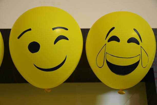 istock Different types of emoji faces on balloons 1190325314