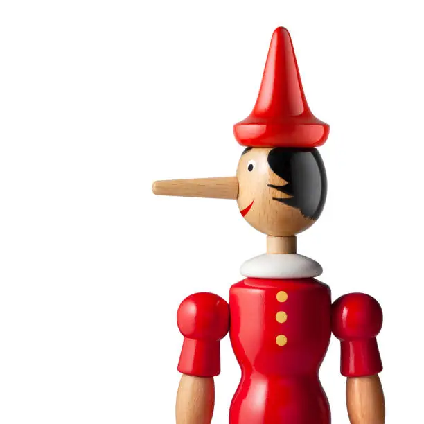 Lie. Pinocchio  on white background. Photo with clipping path.