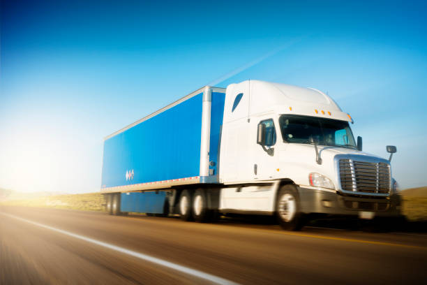 istock Semi Truck Moving in Speed on Highway 1190325588