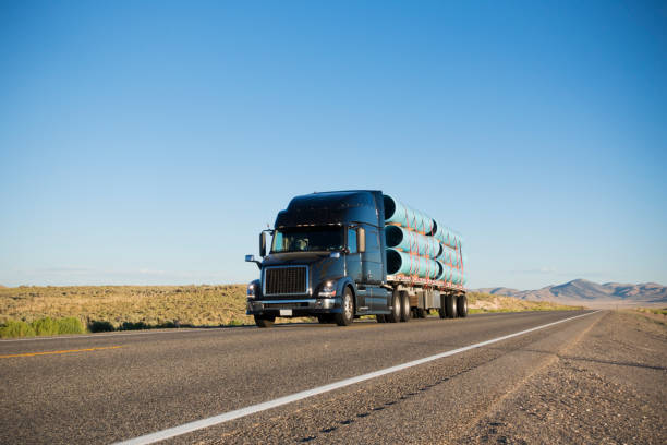 Semi Truck Carrying Construction Materials on Highway stock photo