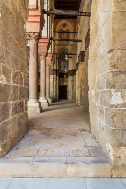 istock Passage at Sultan Qalawun Mosque with stone columns and colored stained glass windows, Cairo, Egypt 1190328436