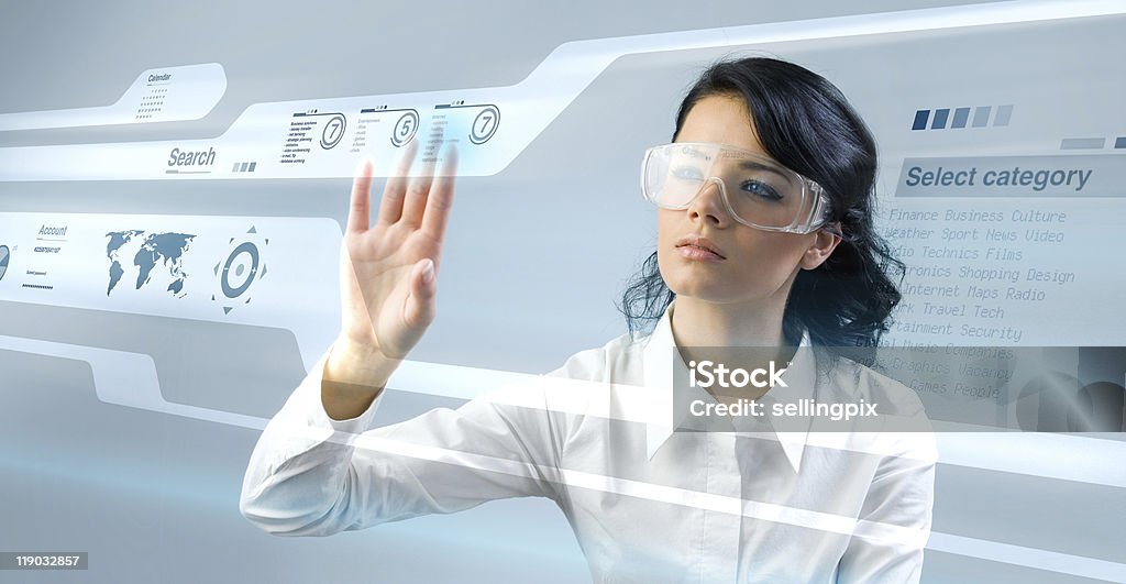Pretty young lady using new technologies  Eyeglasses Stock Photo