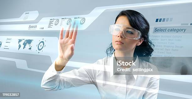 Pretty Young Lady Using New Technologies Stock Photo - Download Image Now - Eyeglasses, Forecasting, Women