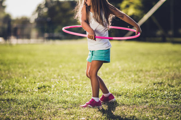 istock Beautiful girl with hula hoop 1190328798