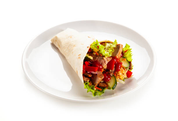 istock Kebab - grilled meat and vegetables on white background 1190328875