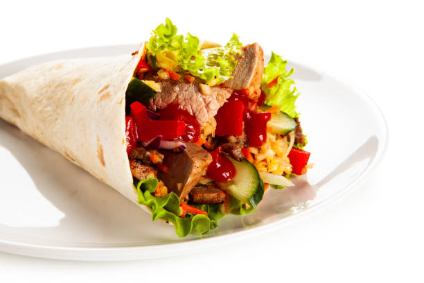 istock Kebab - grilled meat and vegetables on white background 1190328925