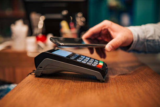 istock Making a contact-less smart phone payment. 1190331048