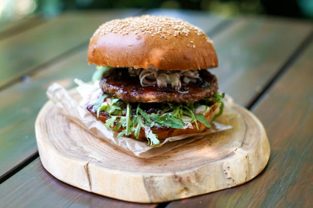 istock Meaty hamburger in a restaurant 1190331769