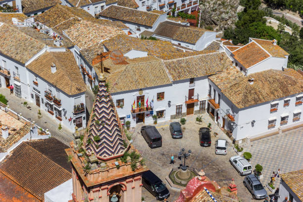 Church tower and town hall in Zahara de la Sierra Church tower and town hall in Zahara de la Sierra, Spain grazalema stock pictures, royalty-free photos & images