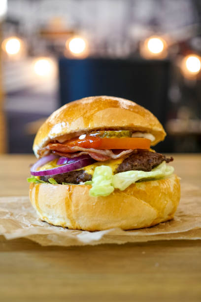 istock Meaty hamburger in a restaurant 1190335771