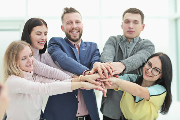 istock smiling young business team showing their unity 1190335776