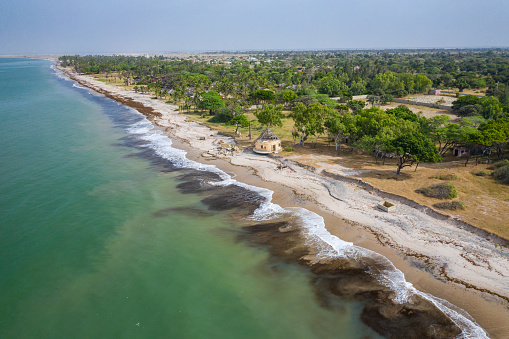 Aerial view of Atlantic coast near Palmarin. Saloum Delta National Park, Joal Fadiout, Senegal. Africa. Photo made by drone from above.