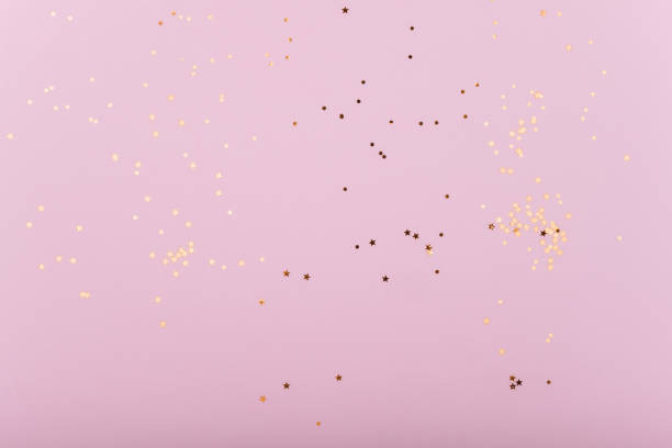 istock Trendy pink background with gold sequins and stars 1190342382