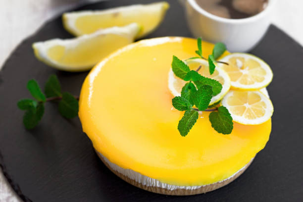 istock Creamy lemon cheesecake and coffee on rustic plate 1190344667