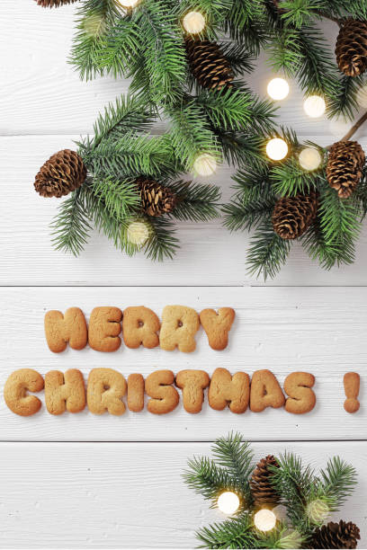 istock greeting card with decorative christmas gingerbread cookies and christmas tree branches 1190344728