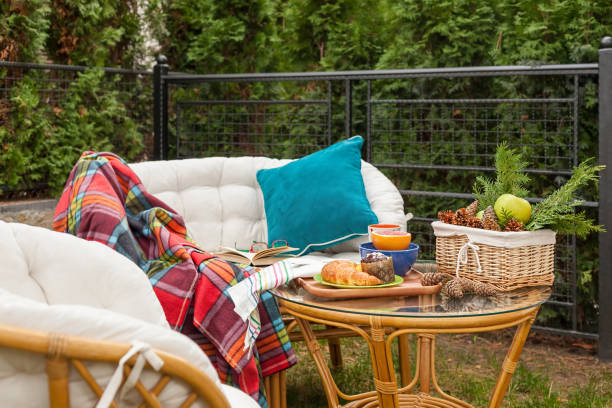 Relaxation with snacks on the table in the garden on a warm clear autumn day - idyllic concept of the weekend break