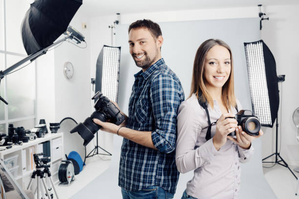 professional photographers in the studio - happy kid flash imagens e fotografias de stock