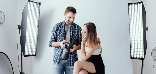 istock Professional photographer and young model 1190347804