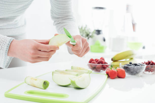 istock Woman preparing an apple 1190349188