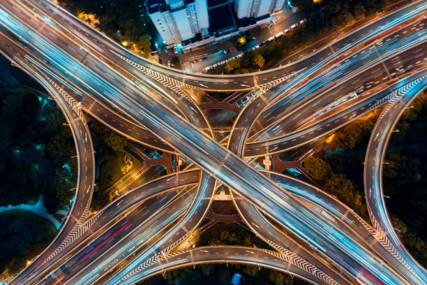 istock Urban highway traffic shanghai at night 1190349617