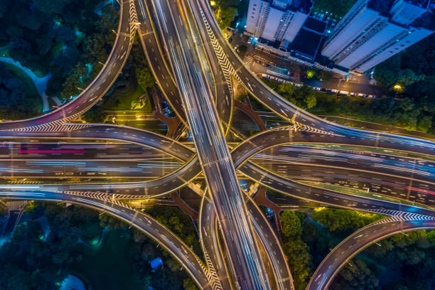 istock Urban highway traffic shanghai at night 1190349681